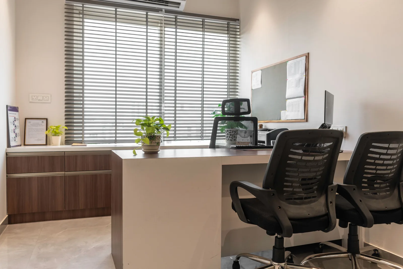 Tidy private office with clean desk and blinds