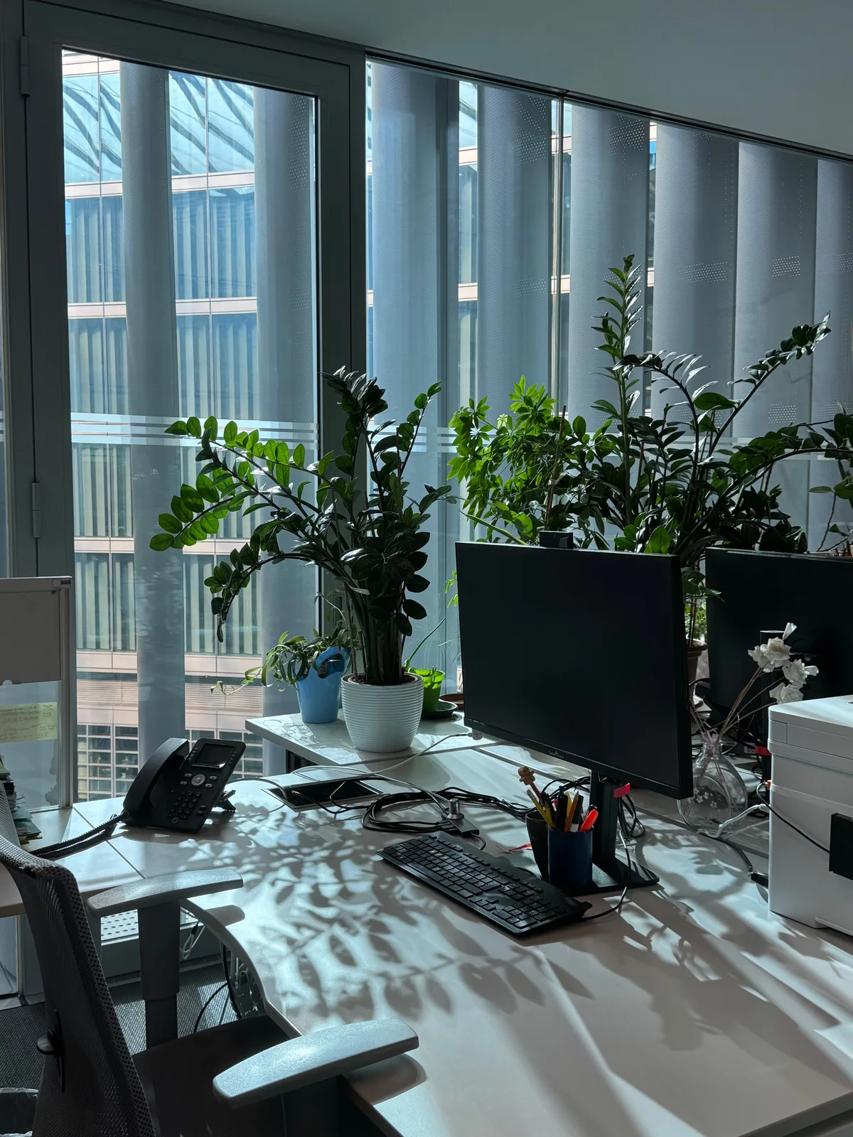 Clean workstation by floor-to-ceiling windows