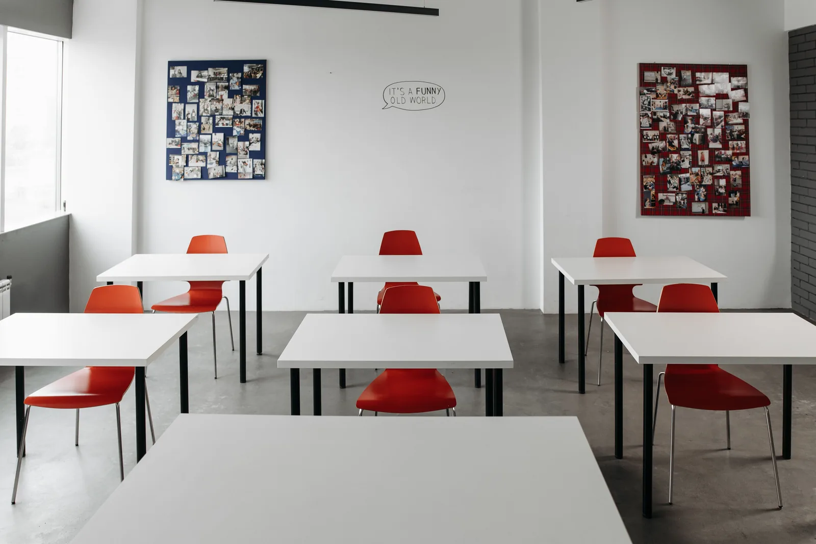 Bright clean classroom with red chairs